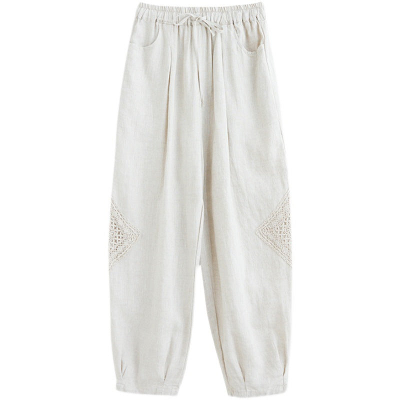Front view of white cropped harem pants with crochet details