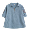 Blue cotton linen women's polo shirt with floral embroidery on the sleeves