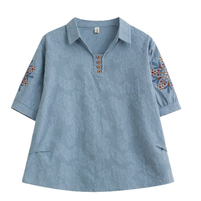 Blue cotton linen women's polo shirt with floral embroidery on the sleeves