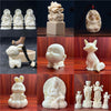 Collage of carved ivory fruit figurines including Buddhas, a dragon seal, a pendant, a fox, a rabbit and monks