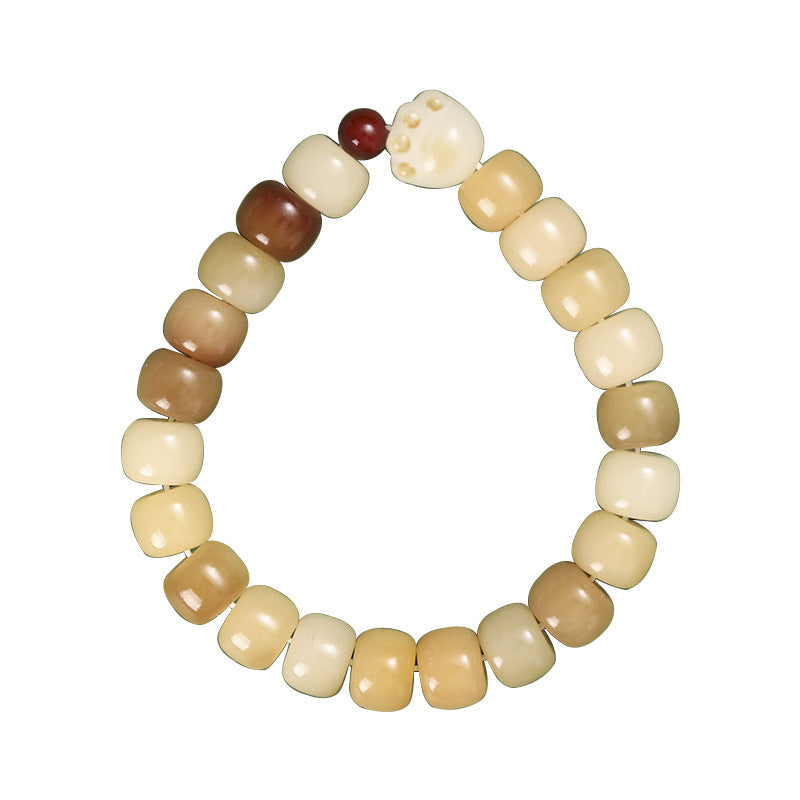 Single strand bracelet with cream and brown bodhi seed beads and a white cat paw charm