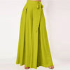 Front view of lime green wide leg pants with a tie waist on a model