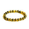 Close up of a yellow agate bead bracelet on a white background