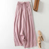 Pink wide leg linen blend pants laid flat on a white background