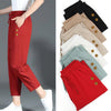 Woman wearing red linen blend cropped pants with side pockets