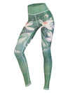Side view of a woman wearing green floral print high waist yoga leggings in a tree pose