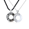Pair of silver zodiac constellation pendants, one black obsidian and one white stone