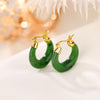 Pair of gold plated 925 silver hoop earrings with natural green jade stones