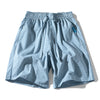 Light blue plaid cotton shorts with elastic waistband