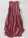 Flat lay of a red plaid sleeveless midi dress on white background