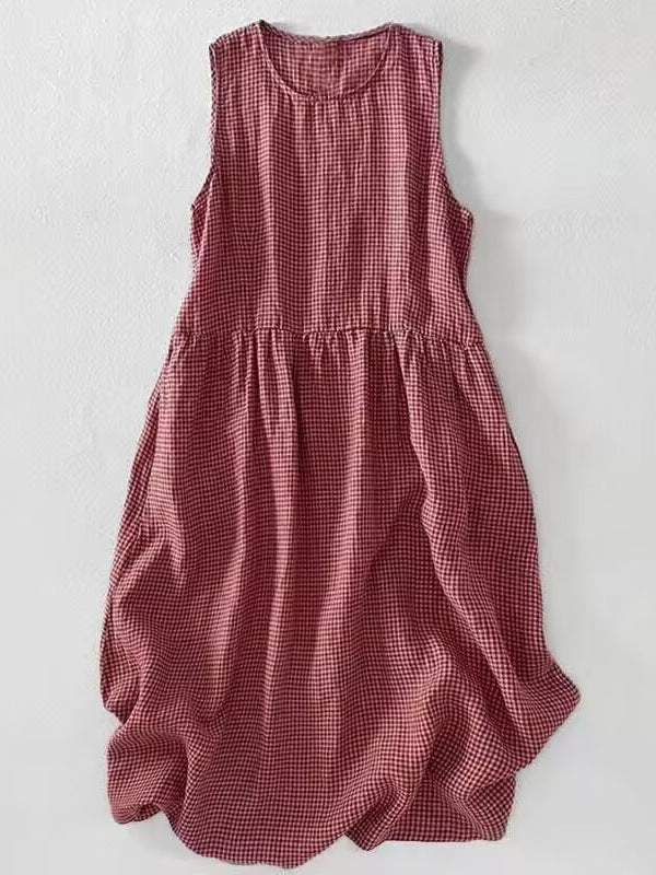 Flat lay of a red plaid sleeveless midi dress on white background