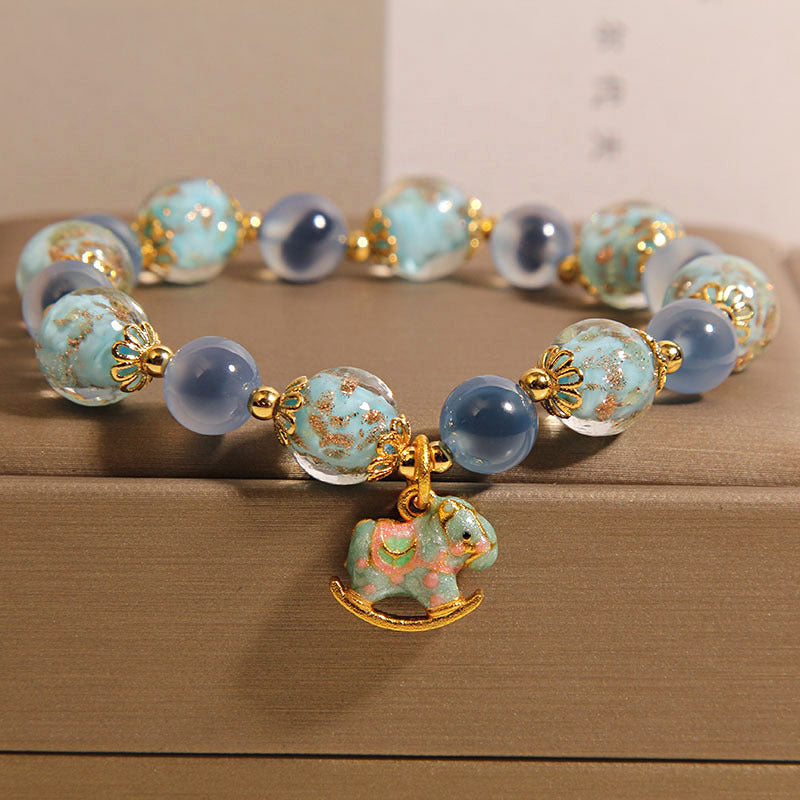 Blue Agate Bracelet with Rocking Horse Charm and Glow Glass Beads