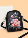 Small vertical crossbody bag made of black PU leather with pink flower embroidery