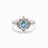 Silver plated lotus flower ring with blue zircon stone on white background