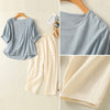 Light blue cotton top and cream pants outfit set displayed on hanger