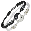 Pair of black and white woven bracelets with silver Yin Yang charms