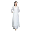 Woman wearing a white long-sleeved midi dress with a V-neck