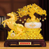 Gold-tone resin statue featuring a rearing horse next to a yellow crystal tree on a wooden base