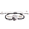 Two woven bracelets with a split Yin Yang dragon charm