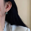 999 Silver and Green Stone Peace Buckle Earrings