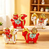 Red and white resin goat figurines with gold horns and ornaments
