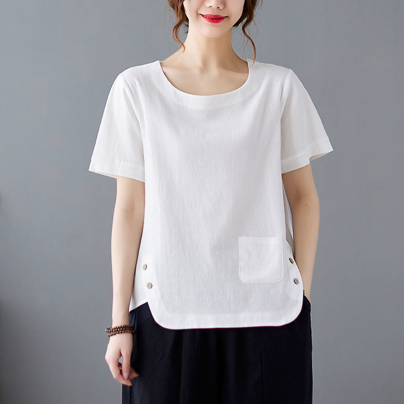 Model wearing a white cotton linen t-shirt with side buttons and a pocket