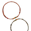 Two hand-braided rope bracelets with koi fish charms on a white background