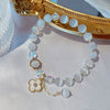 Crystal and Cat's Eye Charm Bracelet with Star, Moon and Flower Beads