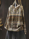 Front view of a beige cotton knit hoodie with a geometric pattern hanging on a wooden hanger