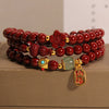 Triple wrap cinnabar bracelet with gourd and flower charms