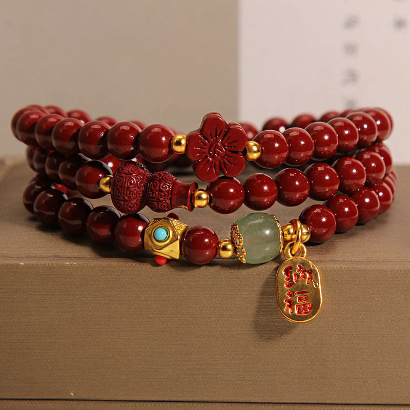 Triple wrap cinnabar bracelet with gourd and flower charms