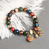 Liuli Glass Bead Bracelet with Swallowing Beast Charm
