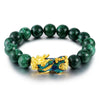 Close up of green agate bead bracelet with gold Pixiu charm