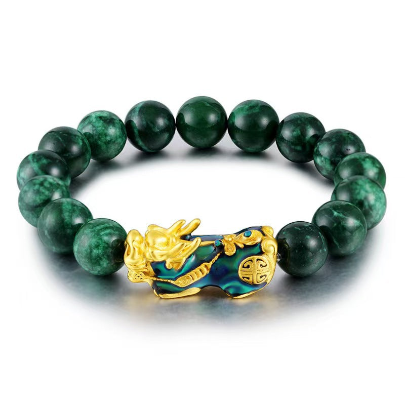 Close up of green agate bead bracelet with gold Pixiu charm
