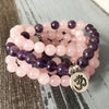 Multi-strand pink and purple stone mala bracelet with silver Om charm