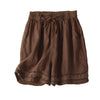 Brown cotton linen shorts with lace trim at the hem