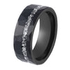 Black tungsten steel ring with faceted texture and silver meteorite inlay on dark stone