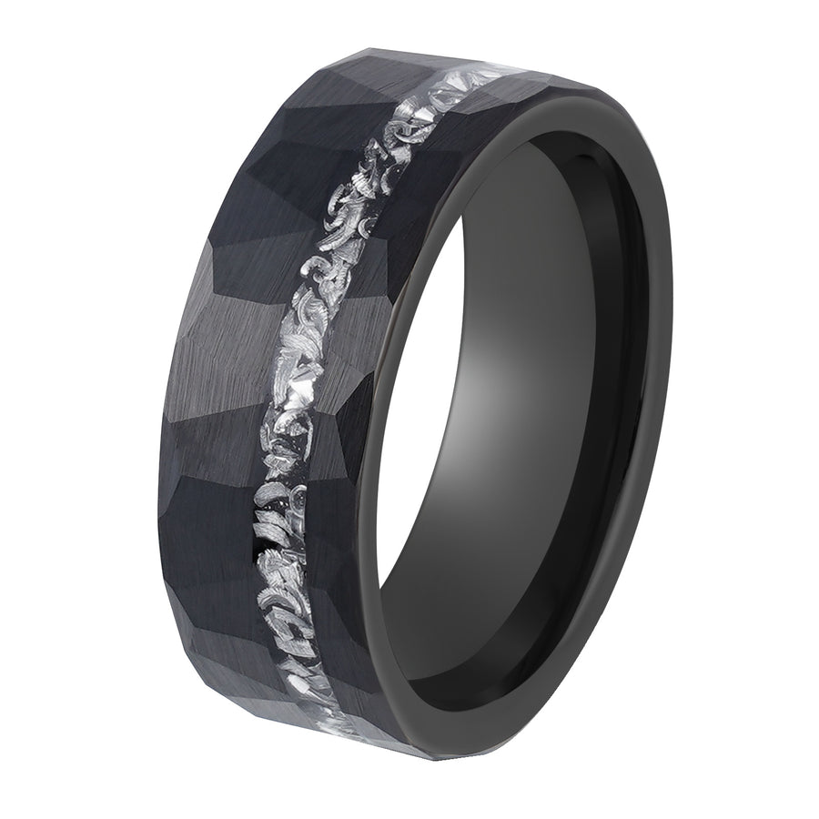 Black tungsten steel ring with faceted texture and silver meteorite inlay on dark stone