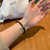 Black Glass Bead Bracelet with Green Accent