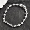 Silver-Plated Beaded Bracelet with Geometric Charms