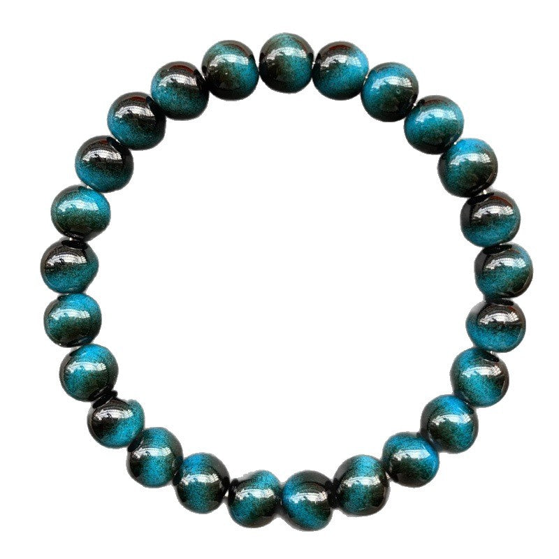 Close up of a blue tiger eye bead bracelet on a wrist