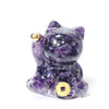 Small resin cat figurine filled with purple amethyst chips holding a gold coin