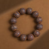 Wood Bead Bracelet with Engraved Charms and Tassel