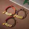 Three variations of a Five Emperor Coins bracelet with cinnabar or amethyst beads