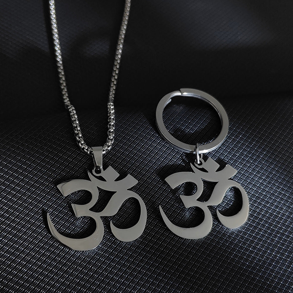 Silver tone stainless steel necklace and keychain featuring an Om symbol pendant