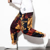 Man wearing colorful printed cotton linen harem pants with white sneakers