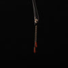 Black wooden hairpin with gold bamboo detail and hanging red agate beads