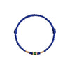 Blue braided rope bracelet with a central gold-tone and green koi fish charm