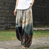 Woman wearing loose printed wide leg pants with crane pattern