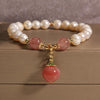 Freshwater Pearl Bracelet with Peach or Persimmon Charm